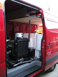 Van mounted pressure washer viewed from side door